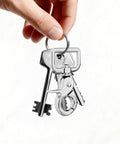 Hand holding keyring with heavy duty swivel snap hook 2.24 inch length, attached with keys, showcasing 360 degree tangle free swivel.