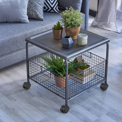 Metal table with wire basket and decor items on top, featuring 2 Inch Nylon Caster Wheels With Brake, 5/16-18 Threaded Stem UNC Coarse Thread.