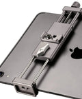 Full Metal Tablet Tripod Holder With Universal Clamp And Arca Swiss Dovetail Mounts for iPad Mini Pro shown attached to a tablet