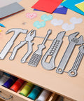 Must Have All Purpose Die Cut For Card Making And Scrapbooking with intricate tool-shaped metal cutting dies on a crafting table