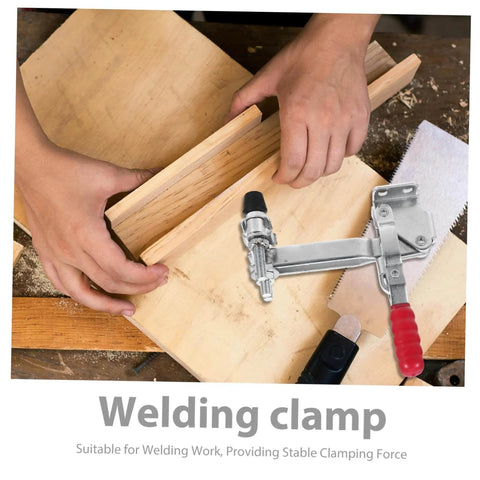 Hands using Two Pack Vertical Toggle Clamp Welding Fixture For Quick Release And Heavy Duty Hold Down In Welding And Metalworking.