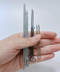 Hand holding candle making tools from All In One Candle Making Kit For DIY Fans With Punching Needle Wick Insertion Tools by Phinicco