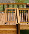 Wooden deck with wooden and black metal railing, showing a gate for smooth access, use with Heavy Duty Sliding Gate Kit Black Hardware Set.