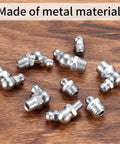 60 Piece Metric Grease Fittings Kit showing various metal zerk fittings for grease guns and mechanical lubrication on wooden surface.