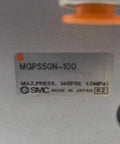 Close-up of MGP Compact Guide Cylinder 50mm Heavy Duty Actuator MGPS50N-100 label, showing SMC branding and pressure rating.