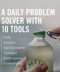 Leatherman Micra Keychain Multi Tool With Scissors And Knife opening a bottle, showcasing its compact stainless steel design.