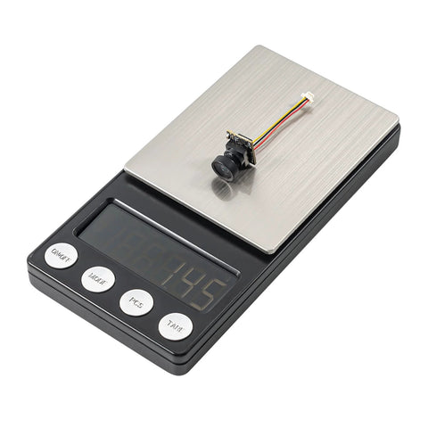 C03 FPV Micro Camera One Third Inch CMOS Sensor 1200TVL Global WDR on digital scale