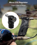 Side view of Adjustable Paintball CO2 Regulator For HPA LP SLP Tanks GEN2 installed on paintball gun, 20 to 200 PSI output