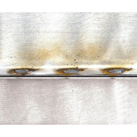 Close-up of sheet metal welds created using MIG Welding Torch Spot Weld Adapter Kit duplicating full penetration OE welds