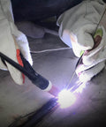 Welder using Mild Steel ER70S-6 Copper Coated Shielded Gas MIG Welding Rod for structural fabrication