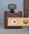 Close-up of 20 Pieces Mini Ball Transfer Bearings 1/3 Inch Nylon Cup with Stainless Steel Ball on wooden furniture