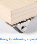 Sixteen Half Inch Mini Low Profile Casters With One Way Micro Wheels Self Adhesive Rubber Rollers installed on wooden furniture corner