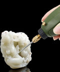 Hand using drill for engraving on white sculpture with Two Pack 3mm Shank Mini Drill Bit With Diamond Point Engraving Needle