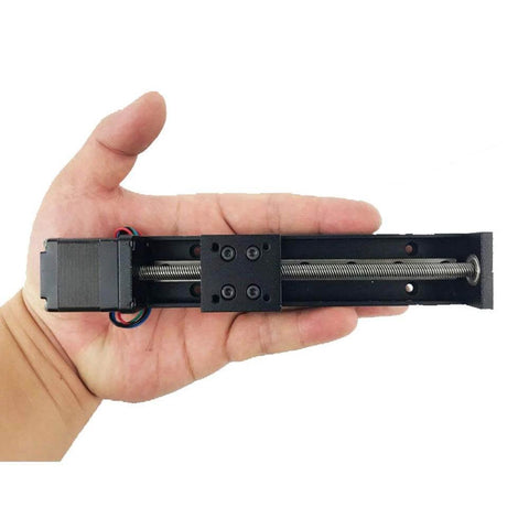 Person holding Linear Rail 100mm Linear Stage Actuator with Square Linear Rails Mini Slide Table + NEMA 11 Stepper Motor