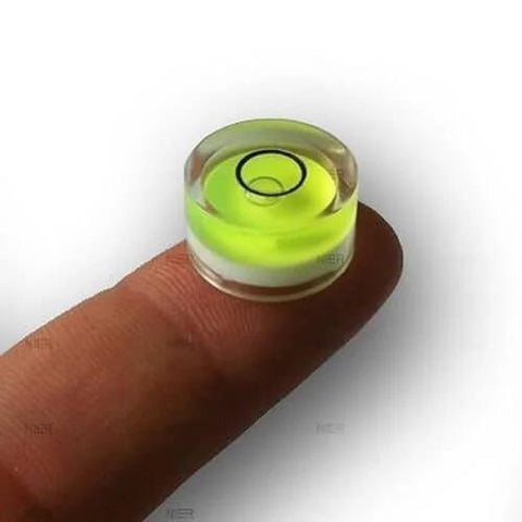 Four compact green round mini spirit levels with clear acrylic housings deliver precise bubble readings for tiny projects