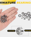 Hand holding set of four SMR63ZZ deep groove ball bearings 3x6x2.5mm 440C stainless steel double shielded ABEC 5 precision mini bearings.