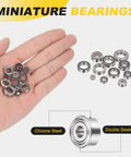 Hand holding set of 4 SMR72ZZ deep groove ball bearings 2x7x3mm 440C stainless steel, double shielded, ideal for robotics and micro machinery.