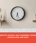 Analog wall clock on shelf, highlighting use for Mixed Alkaline Battery Pack 12 AA 12 AAA With Reusable Plastic Case.