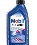 Mobil ATF 3309 bottle labeled as Automatic Transmission Fluid 1 Quart Pack Of 12 For Smooth Shifts And Quiet Operation in blue packaging