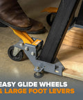 Mobile Base Kit PM-1100 For Heavy Equipment And Tools Adjustable Rolling Dolly Frame with caster wheels and foot lever in use.