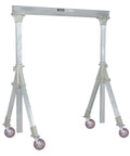 Industrial gantry crane with red caster wheels, adjustable aluminum frame, and load-bearing support for heavy equipment.
