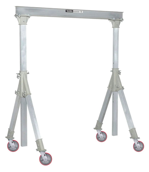 Industrial gantry crane with red caster wheels, adjustable aluminum frame, and load-bearing support for heavy equipment.