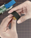 Hands using Gundam Model Sanding Sponge Kit 400 To 1200 Grit Wet Dry Reusable 30 Sheets on a model part
