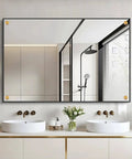 Modern bathroom with mirror reflecting shower, double sinks, and contemporary lighting fixtures.