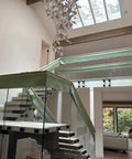 Indoor balcony with glass railings using Heavy Duty Satin Stainless Steel Glass Clamp Standoffs Inline Design 2 Inch For 3/8 1/2 9/16 Inch Glass Thickness Pack Of 2 Marine Grade AISI 316 Stainless Steel For Indoor Outdoor Use On Balconies Decks And Stairs Railings.