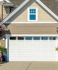 Front view of house with closed white sectional garage door, illustrating use of Bottom Lifting Brackets For Sectional Garage Doors, 7/16 Inch Roller