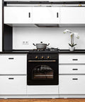 Modern kitchen with black and white cabinets featuring Bulk 50 Pack 2 Inch Black Matte T Bar Cabinet Knobs for a sleek look.