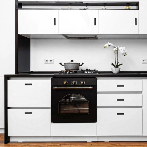 Modern kitchen with black and white cabinets featuring Bulk 50 Pack 2 Inch Black Matte T Bar Cabinet Knobs for a sleek look.