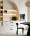 Modern kitchen with 10 Pack 5 Inch Gray Kitchen Cabinet Handles on white cabinets and black table