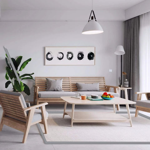 Modern living room with wooden furniture and artistic decor, featuring a cozy seating area and abstract art on the wall.