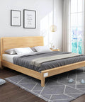 Modern bedroom with a wooden platform bed, gray bedding, and light wood nightstands, accented by a large window and wall art.