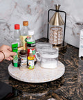 12.6 inch decorative lazy susan turntable with mother of pearl inlay, handcrafted tray displaying condiments on a kitchen counter.