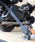 Deluxe Motorcycle Wheel Chock Kit With Quick Release Ratchet Straps And D Ring System Orange And Black For Rock Solid Front And Rear Tie Downs From Lock N Load securing a motorcycle on a trailer.