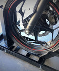 Side view of a motorcycle front tire in Heavy Duty Beefy Motorcycle Wheel Chock For Trailers And Garages By MaxxHaul, 1800 Pound Capacity