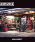 Craftsman brand workshop scene: pegboard tools, red tool chest, and a man beside a motorcycle.