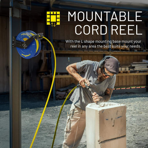 Worker using mountable cord reel attached to vertical post; retractable air hose connected to power tool on construction site.
