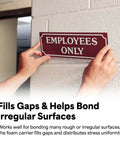 Double Sided Urethane Foam Tape With Super Sticky Acrylic Adhesive For Bonding Attaching And Mounting White 1 Inch By 5 Yard Roll Gap Filling On Textured Or Uneven Surfaces used to attach an 'Employees Only' sign on a textured wall.