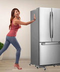 Woman using 4pcs Furniture Moving Dolly Set with 3 Wheel Steel Tri Dollies to push a refrigerator smoothly.