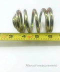 Two Pack Replacement Mower Compression Seat Springs 283516 For John Deere with tape measure for size reference.