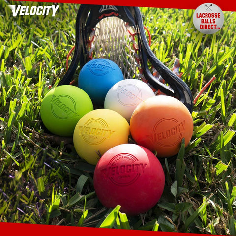 Colorful lacrosse balls on grass with stick, not showing Purple Practice Lacrosse Balls - 1, 2, 3, 6, 12, 18, 24, 36, 60 and 120 Packs