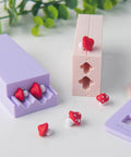 Mushroom Shape Clay Roller for Bead Making with interchangeable ends, shown in use with mushroom-shaped beads and molds.
