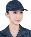 Person wearing navy blue 5 Pack ESD Safe Anti Static Sun Cap with hard brim for cleanrooms, featuring unisex design and adjustable snap back fit.