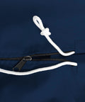Close-up of navy waterproof outboard motor cover zipper and drawstring, made from marine-grade polyester for boats up to 76x65 inches.