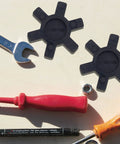 Flexible L100 NBR Rubber Spider Insert for Lovejoy and Martin L Jaw Couplings with tools and hardware on a surface