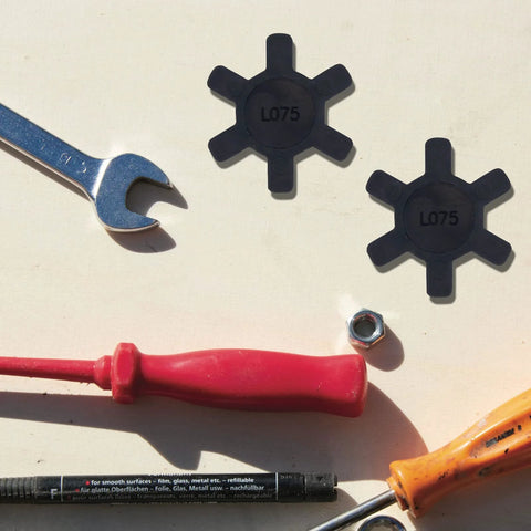 Flexible L075 NBR Rubber Spider Insert For L Jaw Coupling with tools visible around the inserts