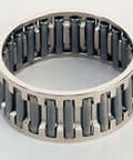 Close-up of a needle roller bearing ring featuring steel rollers and a sturdy metal frame design.